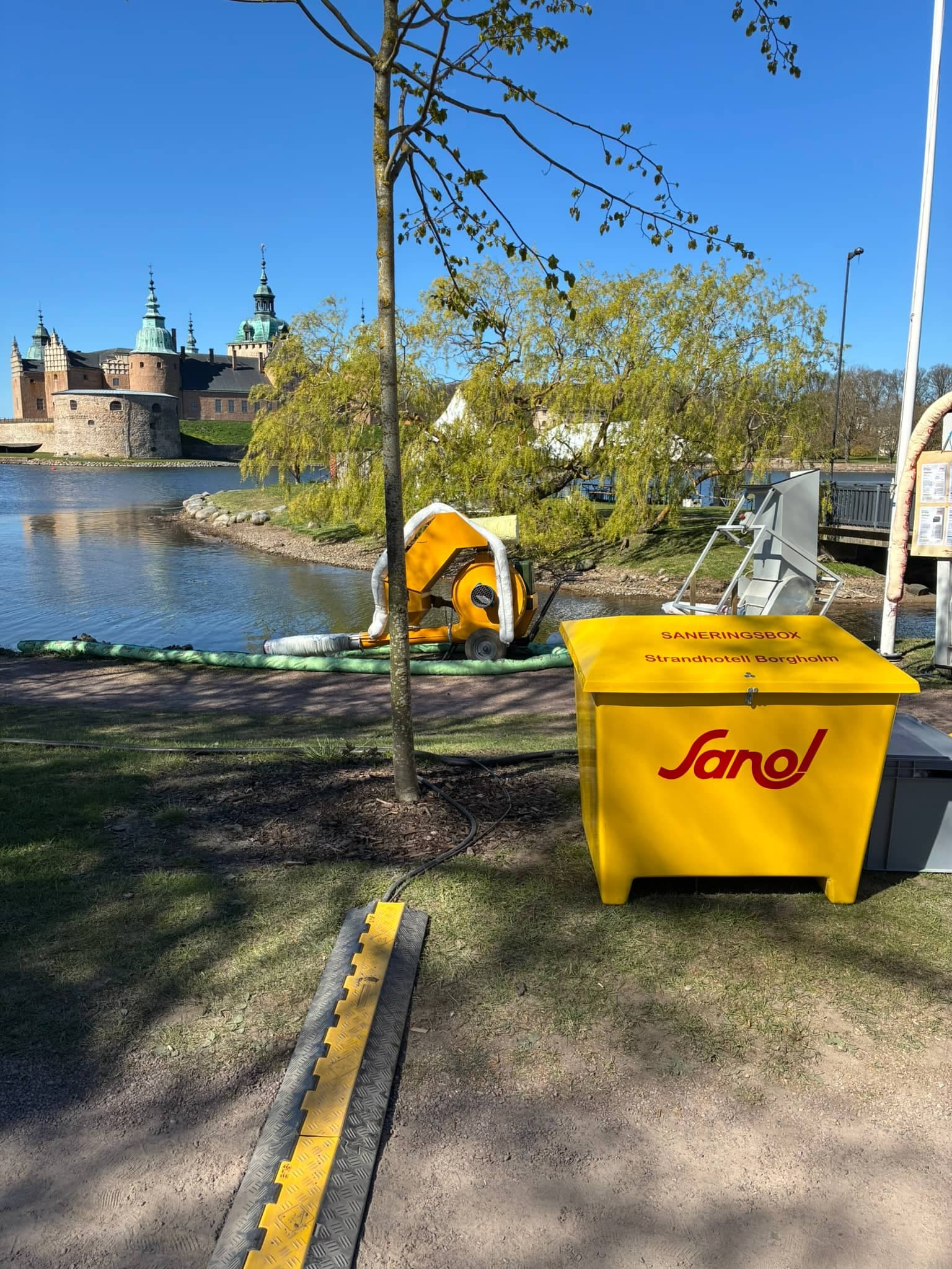 Spillbox by the water with the castle in the background